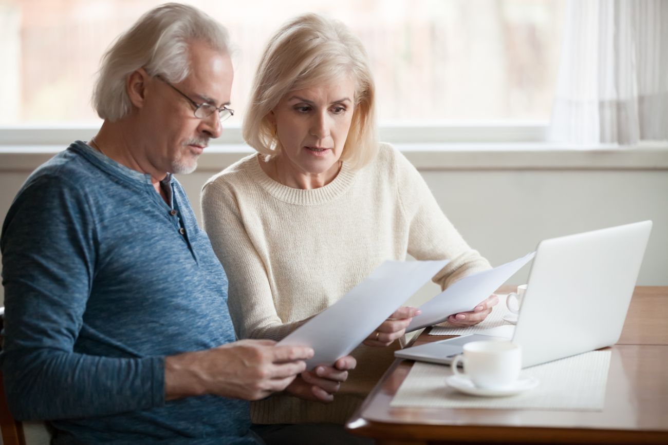 Retired couple looking at finance paperwork