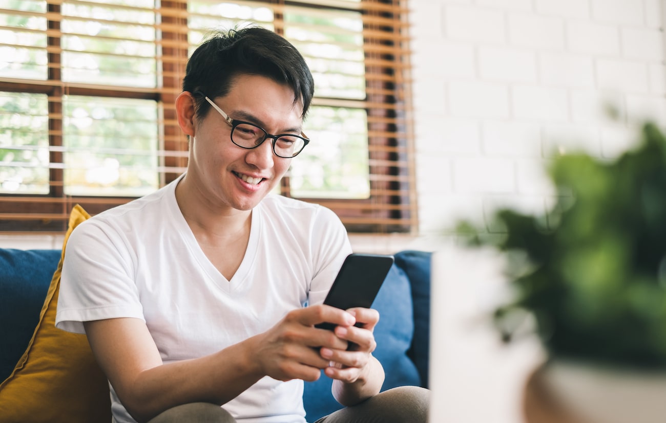 Credit union member using mobile banking app