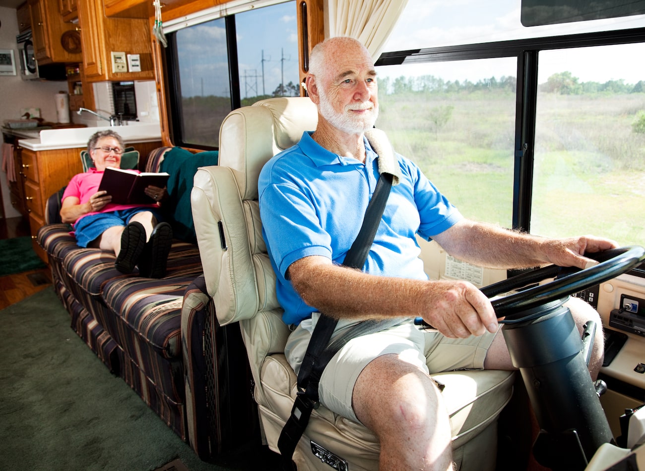 Couple driving an RV