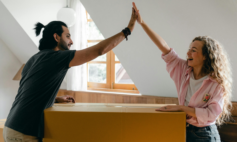 High fiving after buying a house